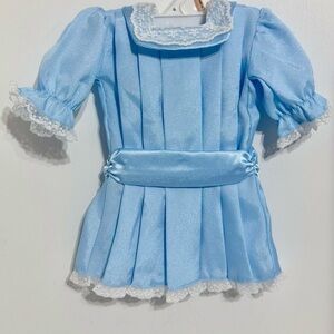 American Girl doll's blue skating party dress from the Samantha collection.